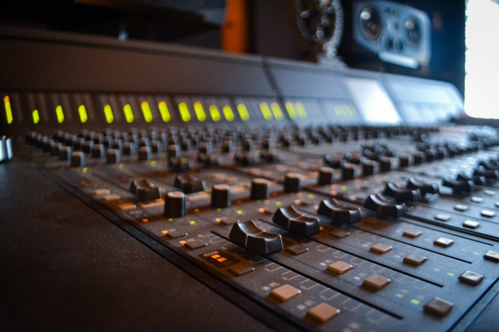 Euphonix CS2000 Console angled view of faders and knobs with meters registering audio